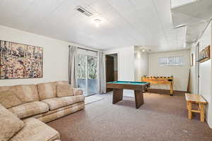 Playroom with carpet flooring and billiards
