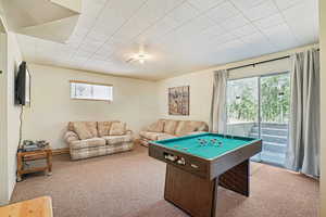 Game room with carpet and billiards table