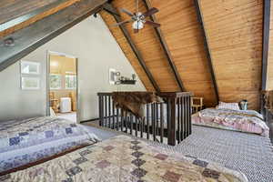 Bedroom with carpet floors, wooden ceiling, and a ceiling fan