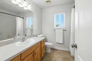 Full bathroom with vanity and a shower