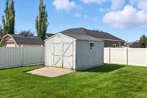 View of shed featuring a fenced backyard