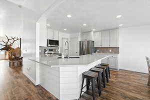 Kitchen with stainless steel appliance