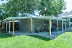 Back of property featuring a patio area and a metal roof