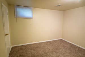 bedroom featuring carpet flooring and baseboards