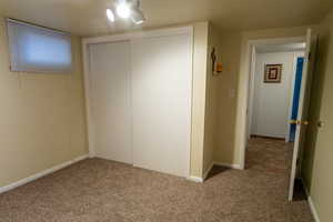 bedroom featuring carpet and a closet