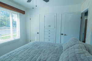 Bedroom featuring multiple closets and a ceiling fan