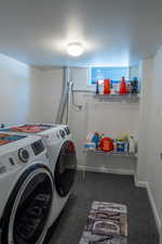 Laundry area featuring washer and clothes dryer