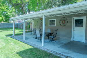 View of patio with ceiling fan