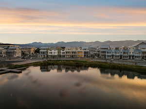 Water view featuring nearby suburban area and mountains