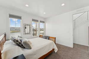 Carpeted bedroom featuring baseboards and recessed lighting