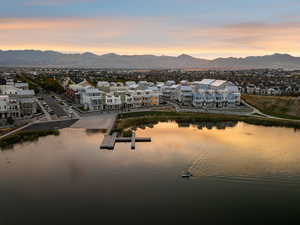 Aerial perspective of suburban area with a water and mountain view