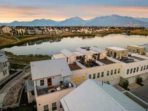 Aerial view at dusk of a water and mountain view and a residential view
