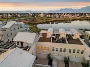 Aerial view of residential area featuring a water and mountain view