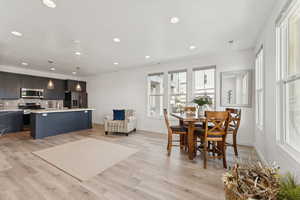 Dining space featuring recessed lighting and light wood finished floors