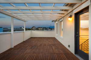 Deck at dusk featuring a residential view