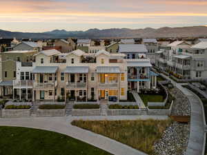 Property at dusk featuring a residential view and a mountain view