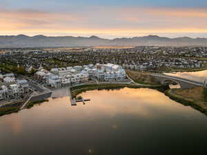 Aerial view at dusk of a residential view and a water and mountain view