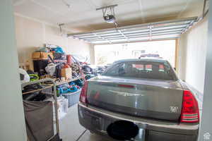 Garage featuring a garage door opener