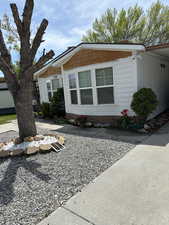 .Beautifully maintained home and yard with offstreet parking, carport, outdoor retreat and two large sheds/workshops.