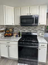 Fully updated move in ready spacious  3 bed 2 bath home with LVP flooring, cozy fireplace, updated kitchen,  designer accent walls and more.