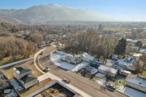 Aerial perspective of suburban area featuring a mountainous background