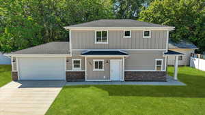 View of front of home with stone siding, roof with shingles, and board and batten siding. Landscaping not included.