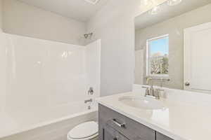 Full bathroom featuring vanity and bathing tub / shower combination
