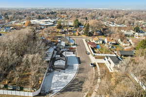 Aerial overview of property's location featuring nearby suburban area