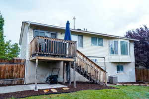 Back of house featuring a patio, stairway, and a deck