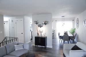 Living area with wood finished floors and plenty of natural light
