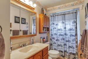 Full bathroom with vanity and shower / tub combo with curtain