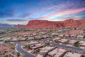 Aerial view of residential area featuring a mountainous background