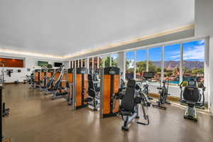 Exercise room featuring a tray ceiling