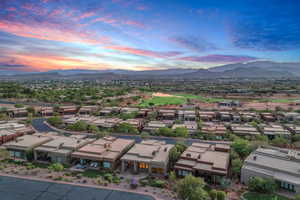 Aerial view at dusk of a mountain view, a residential view, and view of golf course