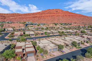Aerial perspective of suburban area with a mountain backdrop
