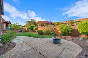 View of patio / terrace featuring an outdoor fire pit