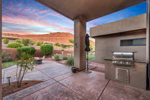 View of patio featuring an outdoor kitchen and a mountain view