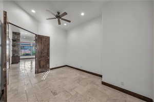 Unfurnished room with stone tile flooring, recessed lighting, and ceiling fan
