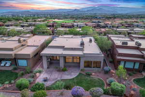 Aerial view of residential area featuring a mountainous background