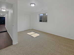 Spare room featuring carpet flooring