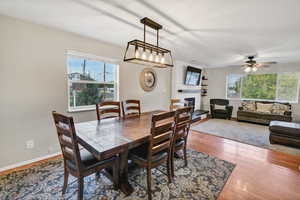Dining room with a fireplace and hardwood / wood-style floors