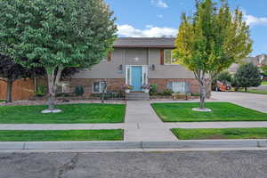 Bi-level home featuring brick siding