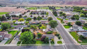 Aerial perspective of suburban area featuring a mountainous background