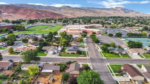 Aerial overview of property's location with mountains and nearby suburban area