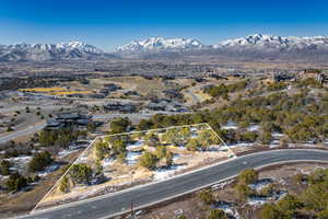 Aerial overview of property's location with a mountainous background