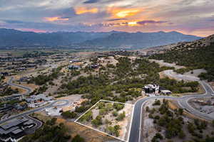 Aerial view at dusk of a mountain view and property boundaries highlighted
