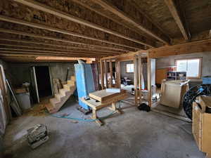 Miscellaneous room featuring unfinished concrete floors