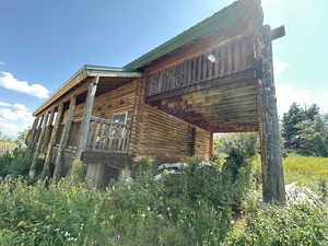 View of property exterior with log exterior