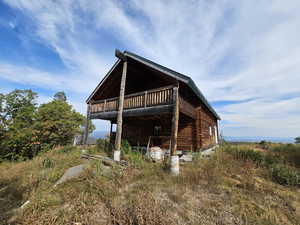 Back of house with a wooden deck