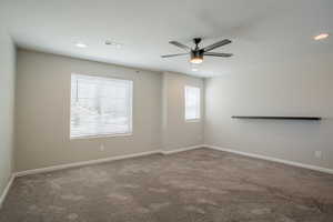 Carpeted empty room featuring recessed lighting and ceiling fan